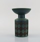 Hilkka-Liisa Ahola (1920-2009) for Arabia. Modernist glazed ceramic vase with 
green and black checkered design. Dated 1968.
