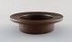 Arabia, Finland. Low bowl in glazed ceramics with grooved edge. Beautiful glaze 
in brown shades. 1960