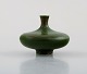 Gösta and Ullalisa Rubenson for Munk, Enköping. Miniature vase in glazed 
ceramics. Beautiful glaze in green shades. Late 20th century.
