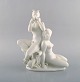Harald Salomon for Rörstrand, white glazed porcelain Art Deco figure of a naked 
woman and flute-playing pan. 1940 s.
