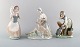 Lladro and Nao, Spain. Three porcelain figurines. Young girls with farm animals. 
1980s.
