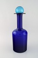Otto Brauer for Holmegaard. Large vase / bottle in blue art glass with blue 
ball. 1960