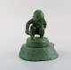 Adda Bonfils (1883-1943) for Ipsens Enke. Jadegrøn figur af pige med skovl i 
glaseret keramik. Modelnummer 889. 1920/30