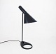 Black table lamp designed by Arne Jacobsen in 1957 and manufactured by Louis 
Poulsen.
5000m2 showroom.