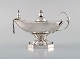 Early Georg Jensen oil lamp in sterling silver. Lid and stem with foliage. Edged 
base with pearls. Design 12. Dated 1933-44.
