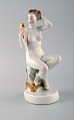 Herend, Hungary. Art deco figure in hand-painted porcelain. Girl with mirror. 
1940