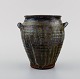 Gutte Eriksen, own workshop. Vase with handles in glazed stoneware. Raku-burnt 
technique. 1950