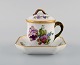 Royal Copenhagen Saxon Flower. Cream cup with saucer in hand-painted porcelain. 
Model number 1542. Early 20th century.

