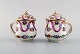 Two antique Dresden cream cups in hand-painted porcelain with flowers and 
ribbons. Early 20th century.
