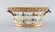 Royal Copenhagen Flora Danica fruit bowl made of porcelain, decorated in colors 
and gold with flowers. Model number 20/3534.
