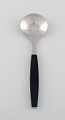 Henning Koppel for Georg Jensen. Strata boullion spoon in stainless steel and 
black plastic. 1960 / 70s. 6 pcs in stock.

