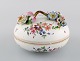 Antique and rare Meissen bonboniere in hand-painted porcelain with repousse 
flowers. 19th century.
