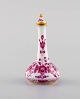 Meissen Pink Indian flacon with stopper in hand-painted porcelain with pink 
floral motifs. 20th century.
