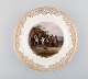 Antique Meissen decoration plate in hand-painted porcelain with hunting motif 
and gold decoration. 19th century.
