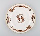 Antique Meissen plate in hand-painted porcelain decorated with birds and gold 
edge. 19th century.
