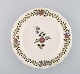 Meissen plate in hand-painted porcelain with floral decoration. 20th century.
