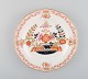 Meissen plate in hand-painted porcelain with floral decoration and gold edge. 
20th century.
