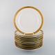 Royal Copenhagen stel nr. 607 White. 12 porcelain dinner plates with gold edge. 
Model number 607/9586.

