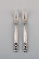 Two Georg Jensen Acorn cold meat forks in sterling silver.
