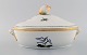 Royal Copenhagen lidded tureen in hand-painted porcelain with bird motifs and 
gold decoration. Early 20th century.
