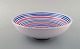 Ingrid Atterberg for Uppsala Ekeby. Large bowl in glazed stoneware. Striped 
design in blue and pink shades. Dated 1951-52.

