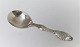 Serving spoon with amber. Length 17.5 cm. Produced 1920.