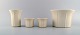 Arabia, Finland. Four flower pot covers in stoneware. Grooved design, 1970s.
