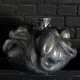 Christina Muff, dansk samtidskeramiker (f. 1971). Stor Skulpturel vase dekoreret 
med spirende blomster. Denne dramatiske skulptur er glaseret med dyb sort glasur 
der har sølvtoner på høje punkter og lejlighedsvist dybe gørnne strejf.