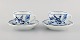 Two antique Meissen Blue Onion coffee cups with saucers in hand-painted 
porcelain. Early 20th century.

