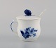 Royal Copenhagen blue flower braided cream cup with porcelain spoon.
