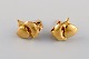 Swedish jeweler. A pair of classic ear studs in 18 carat gold with dolphins and 
hearts. Mid-20th century.
