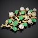 A jewellery set, brooch and ear rings, set with jade and pearls mounted in 14k 
gold