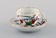 Antik Meissen kaffekop med underkop i håndmalet porcelæn dekoreret med blomster 
og tiger. Ca. 1900.
