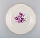 Antique Meissen round serving dish in hand-painted porcelain with purple flowers 
and gold edge. Ca. 1900.
