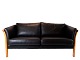 Two-person stretcher sofa upholstered with black leather of Danish design.
