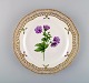 Royal Copenhagen Flora Danica openwork plate in hand-painted porcelain with 
flowers and gold decoration. Model number 20/3554.
