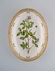Royal Copenhagen Flora Danica oval serving bowl in hand-painted porcelain with 
flowers and gold decoration. Model number 20/3507.
