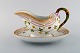 Royal Copenhagen Flora Danica sauce boat in hand-painted porcelain with flowers 
and gold decoration. Model number 20/3556.
