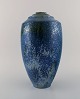 European studio ceramist. Large vase in glazed ceramics. Beautiful metallic 
glaze in shades of blue and gray. Dated 1997.
