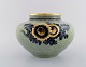 Royal Copenhagen crackled art deco porcelain vase.
Decorated with flowers, gold rim. 1930s.