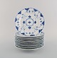 10 Royal Copenhagen blue fluted full lace plates in openwork porcelain. 
Decoration number: 1/1086.
