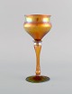 Antique Tiffany Favrile wine glass in iridescent mouth blown art glass. Early 
20th century.
