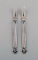 Two Georg Jensen Acanthus cold meat forks in sterling silver.
