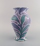 Gunnar Wennerberg for Gustavsberg. Antique unique art nouveau vase in glazed 
ceramics. Beautiful glaze in purple shades with foliage in relief. Dated 1902.
