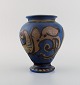 Kähler, HAK. Glazed stoneware vase in modern design. Brown foliage on blue 
background. 1930s / 40s. 
