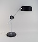 Anders Pehrson for Ateljé Lyktan. Adjustable Simris / Olympia table lamp in 
chromed and black lacquered metal with leather-covered base. Swedish design, 
1960