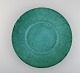 Wilhelm Kåge for Gustavsberg. Argenta art deco dish in glazed ceramics. 
Beautiful glaze in shades of green. 1940s.
