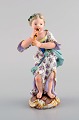 Antique Meissen figure in hand-painted porcelain. Girl playing flute. Late 19th 
century.
