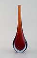 Murano vase in reddish and clear mouth blown art glass. Italian design, 1960 / 
70s.
