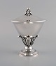Johan Rohde for Georg Jensen. Lidded bowl on base in sterling silver decorated 
with foliage. Model number 17C. Late 20th century.
